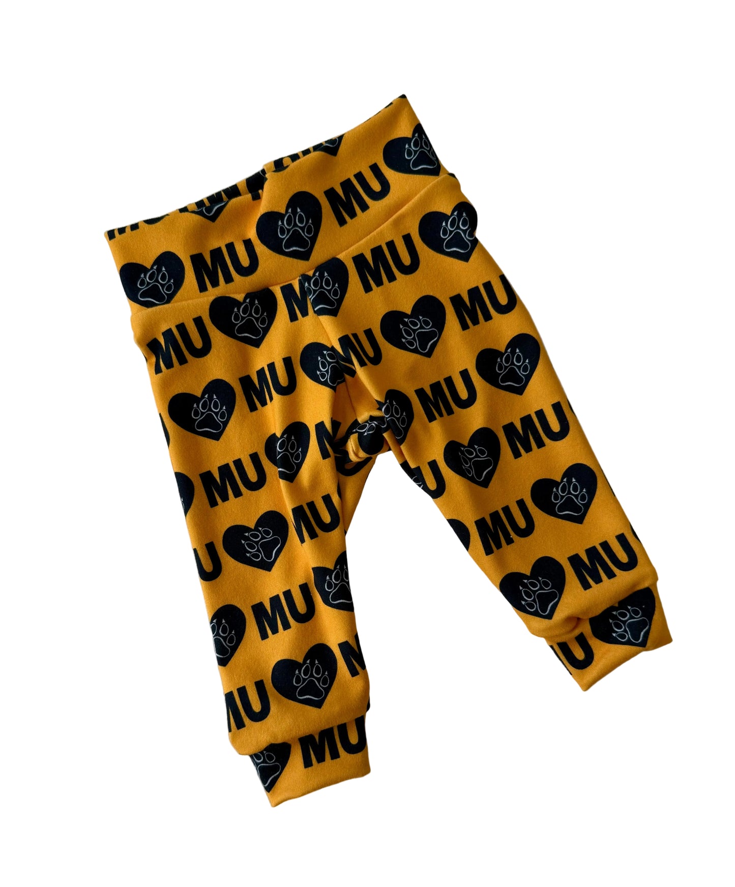 Yellow leggings with black heart and 'MU' pattern on a white background