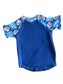 Blue fabric with baseball-themed trim on a stone surface