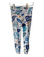 Leggings with blue kc baseball graphics on a white brick wall background