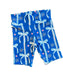 Blue patterned fabric with white bows and 'KC' branding on a dark surface