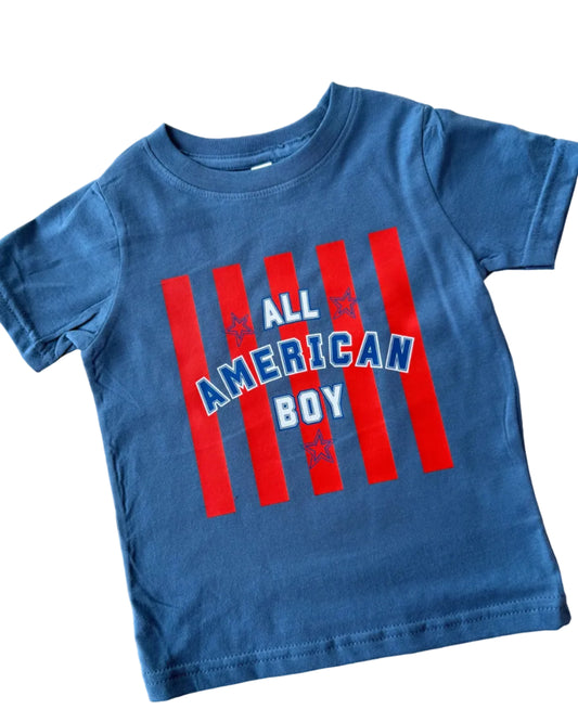 Blue t-shirt with 'All American Boy' text on a tiled floor